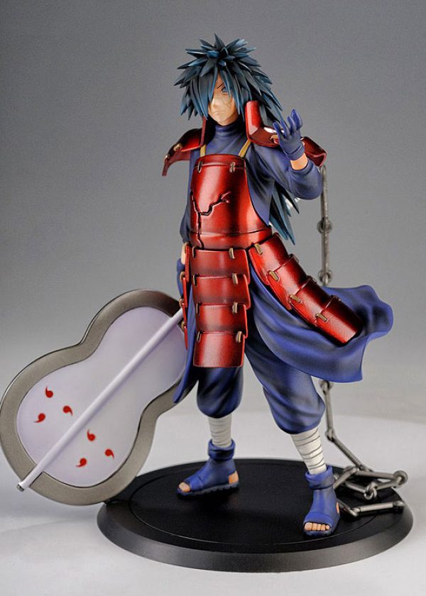 A detailed figurine of an anime male character with long blue hair, wearing red armor over a blue outfit, posed with one hand raised and holding a large fan weapon. shonen fusion